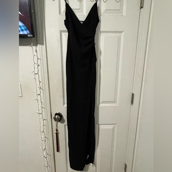 Just a plain black dress with a open leg slit. - Picture 1 of 4